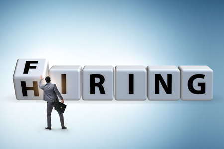 Hiring and firing concept with turning cubesの写真素材