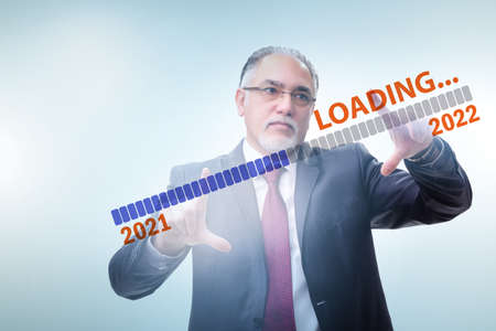 Businessman pressing virtual button with year 2022の写真素材