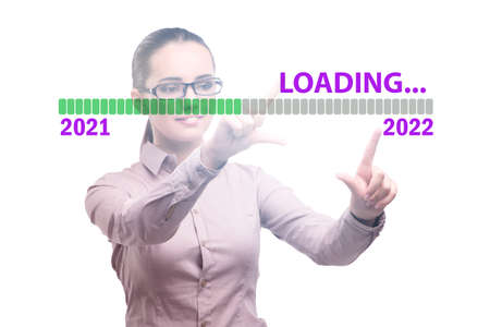 Businesswoman pressing virtual button with year 2022の写真素材