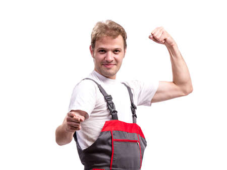Young construction worker wearing coveralls isolated on white