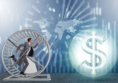 Business concept with businessman running on hamster wheelの写真素材