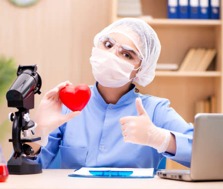 Young woman doctor working in the labの写真素材