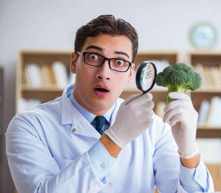 Scientist working on organic fruits and vegetablesの写真素材