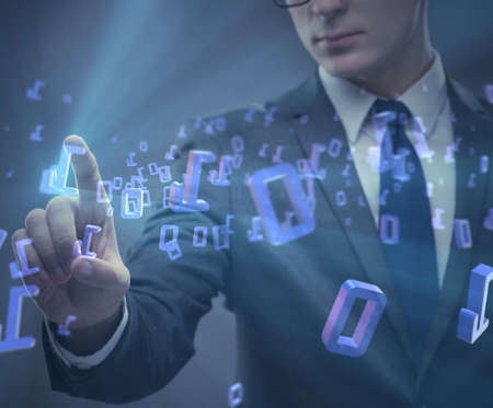 Businessman pressing binary buttons in tech conceptの写真素材
