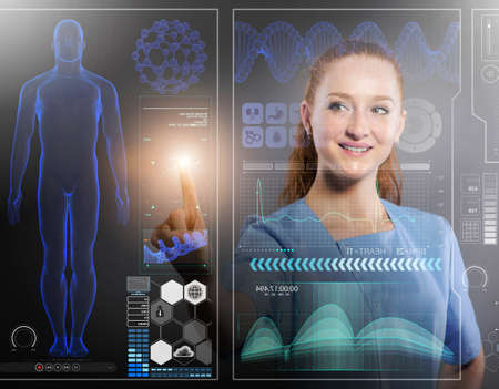 Doctor in futuristic medical concept pressing buttonの写真素材