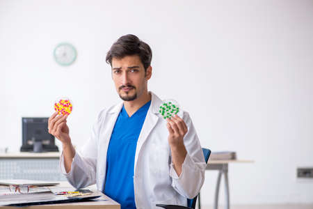 Young male doctor working in the clinic
