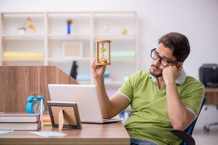 Young male designer working in the office