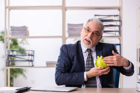 Old male employee in retirement conceptの写真素材