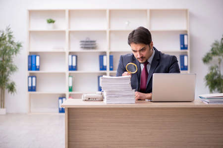 Young male employee working in the officeの写真素材
