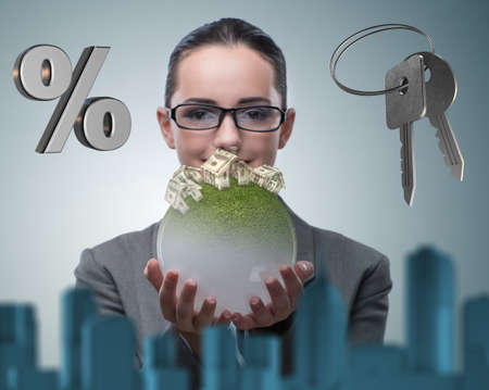 Businesswoman in housing mortgage conceptの写真素材