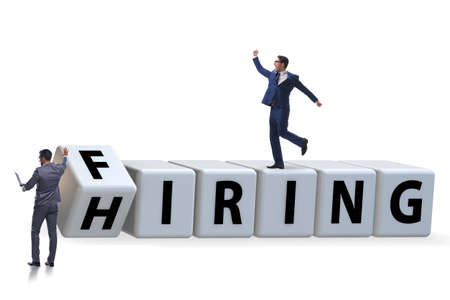 Hiring and firing concept with turning cubesの写真素材