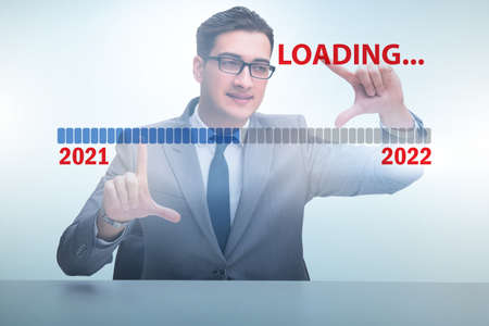 Businessman pressing virtual button with year 2022の写真素材