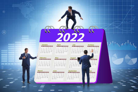 Businessman in the calendar concept of year 2022の写真素材
