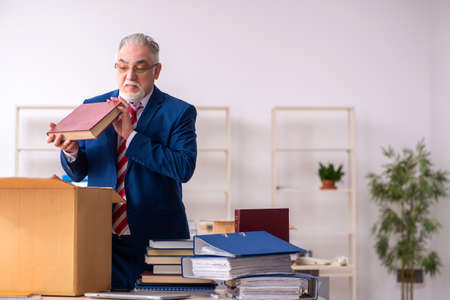 Old male employee in movement conceptの写真素材