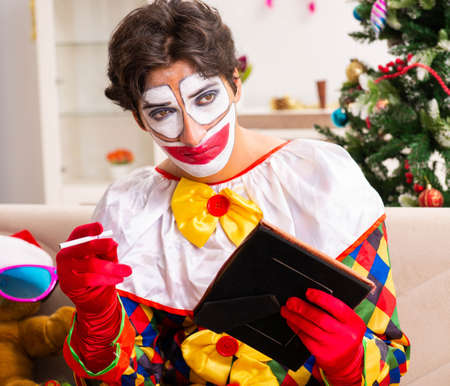 Funny clown in Christmas celebration concept