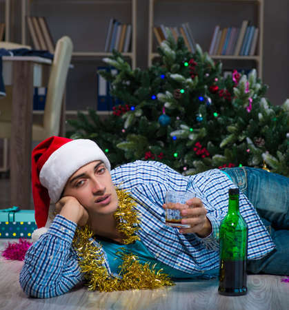 Man celebrating christmas at home aloneの写真素材