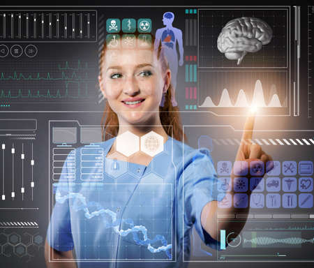 Doctor in futuristic medical concept pressing buttonの写真素材