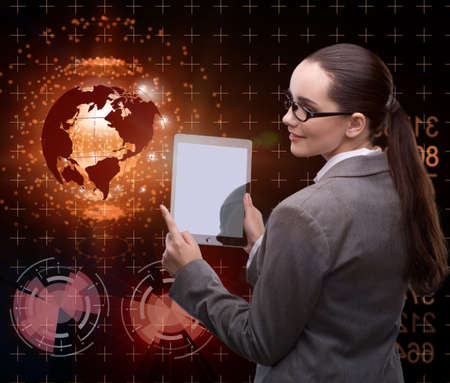 Businesswoman with tablet in global business concept