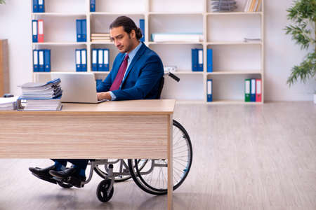 Young disabled employee working in the officeの写真素材