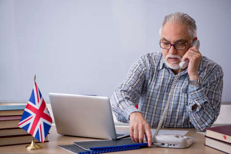 Old english language teacher in the classroomの写真素材