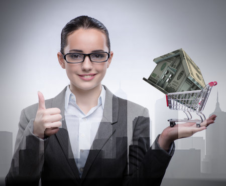 Businesswoman in real estate mortgage conceptの写真素材