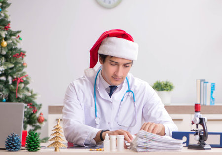 Doctor on the shift on christmas eveの写真素材