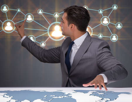 Businessman in social networks conceptの写真素材