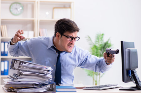 Stressful businessman working in the officeの写真素材