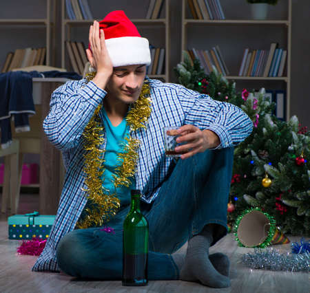 Man celebrating christmas at home aloneの写真素材