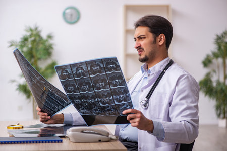 Young male doctor radiologist working in the clinic