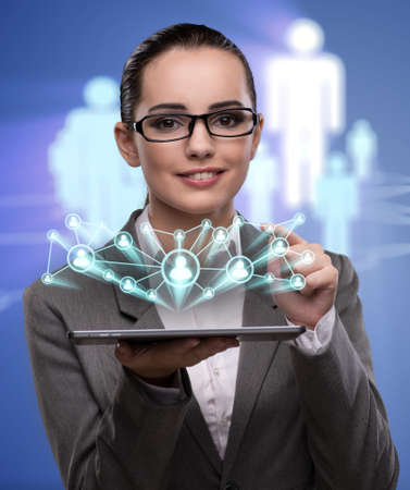Young businesswoman in social networks conceptの写真素材