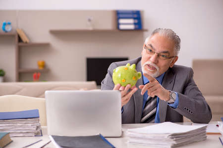 Old male employee in retirement concept during pandemicの写真素材