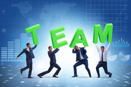 Teamwork concept with people carrying team lettersの写真素材