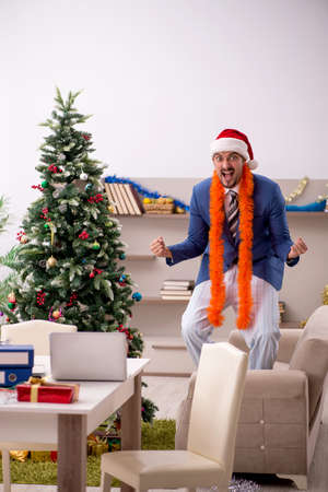 Young businessman working from home at Christmas eveの写真素材