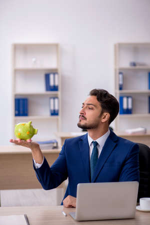 Young male employee in retirement conceptの写真素材