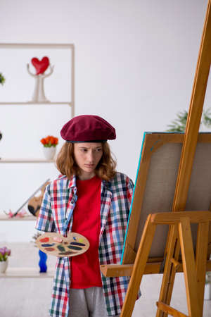 Young girl enjoying painting at homeの写真素材