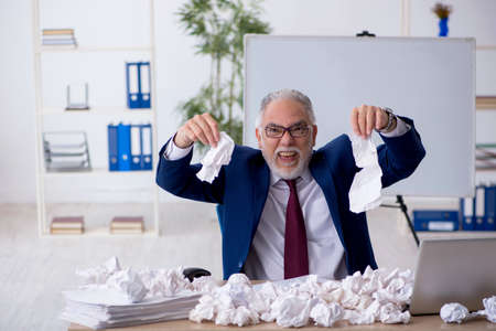 Old male employee in brainstorming conceptの写真素材
