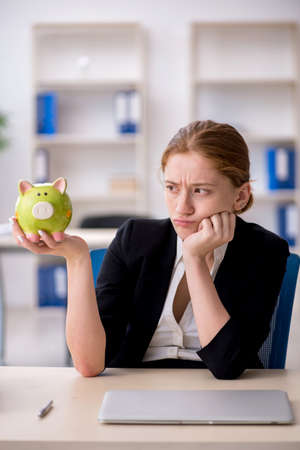 Young female employee in retirement conceptの写真素材