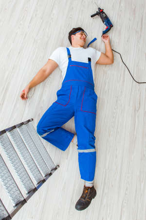 Worker after falling from height - unsafe behaviorの写真素材