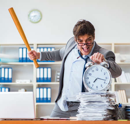 Angry aggressive businessman in the officeの写真素材