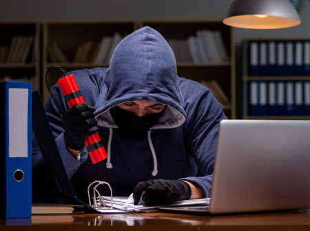 Hacker with dynamite stealing dataの写真素材