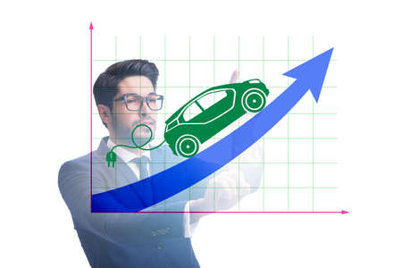 Electric car concept with businessman pressing buttonの写真素材