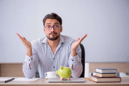 Young male teacher in retirement conceptの写真素材