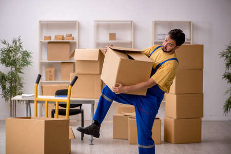 Male contractor doing home relocationの写真素材