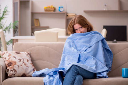 Young woman suffering at homeの写真素材