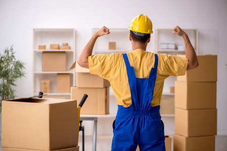 Young male contractor doing home relocation