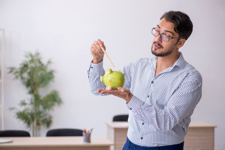 Young male teacher in retirement conceptの写真素材