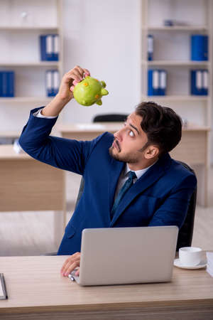 Young male employee in retirement conceptの写真素材