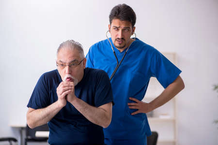 Old man visiting young male doctor