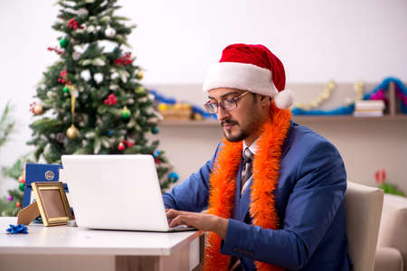 Young businessman working from home at Christmas eveの写真素材